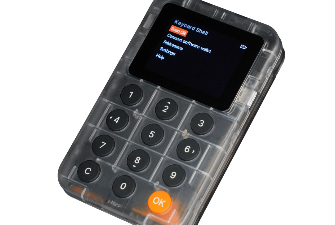Small electronic device with a keypad and screen on a white background